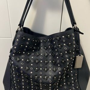 Authentic Coach deep blue chrome daisy studded purse.
